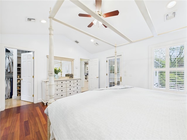 bedroom with a walk in closet, wood finished floors, recessed lighting, ceiling fan, and a closet