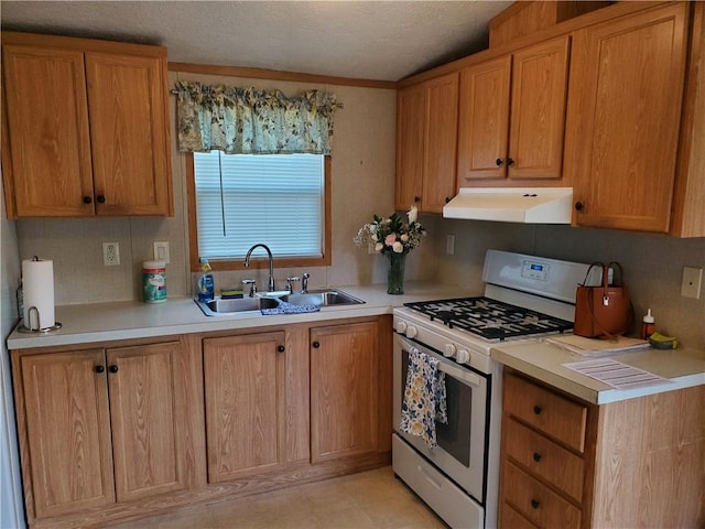 65 Wright Way, Coventry, RI 02816 - kitchen featuring a textured ceiling, light countertops, a sink, under cabinet range hood, and white range with gas stovetop