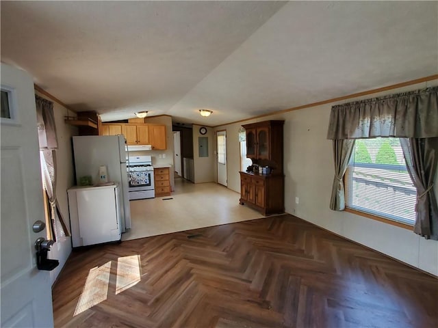 65 Wright Way, Coventry, RI 02816 - kitchen featuring freestanding refrigerator, refrigerator, under cabinet range hood, gas stove, and vaulted ceiling