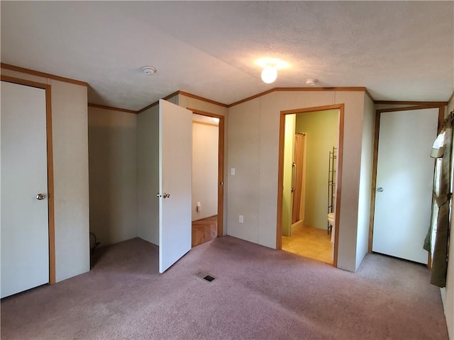 65 Wright Way, Coventry, RI 02816 - unfurnished bedroom featuring carpet floors, ornamental molding, ensuite bathroom, and visible vents