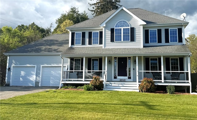 1010 Oakhill Ave, Attleboro, MA 02703 - colonial house featuring a porch, driveway, a garage, and a front lawn