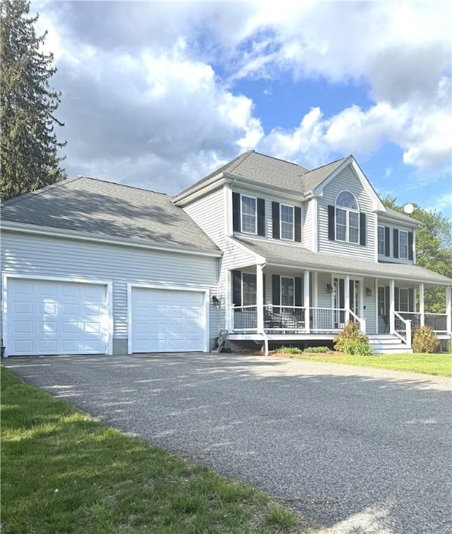 1010 Oakhill Ave, Attleboro, MA 02703 - colonial-style house with an attached garage, asphalt driveway, and a porch