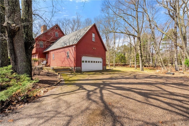 view of barn featuring driveway