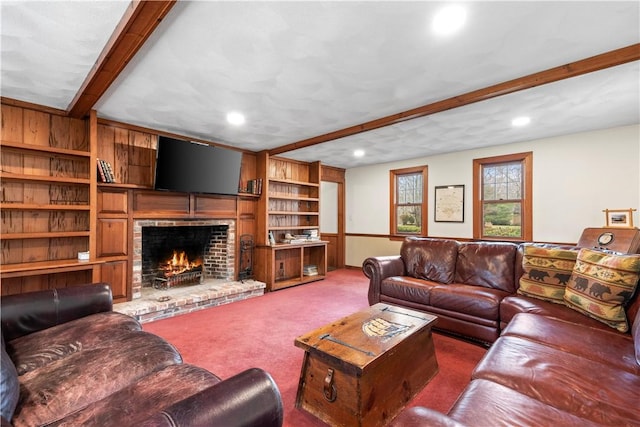 living area featuring recessed lighting, carpet floors, beamed ceiling, and a fireplace