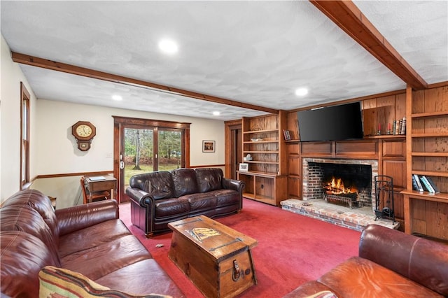 living room featuring carpet floors, built in features, beamed ceiling, a brick fireplace, and recessed lighting