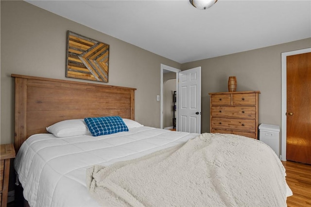 bedroom with wood finished floors