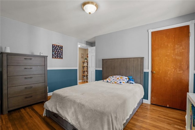 bedroom with wood finished floors