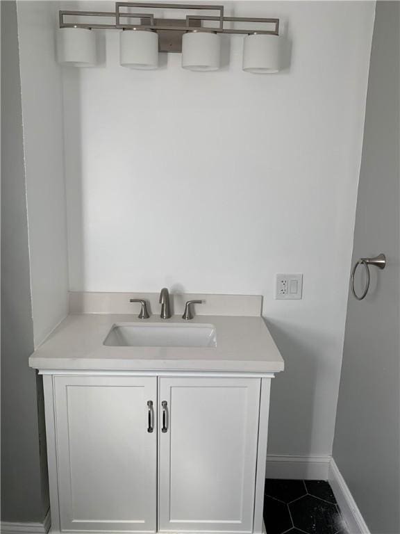 88 Reed St, Warwick, RI 02886 - bathroom with tile patterned flooring, baseboards, and vanity