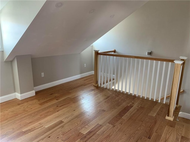 88 Reed St, Warwick, RI 02886 - additional living space with wood finished floors and vaulted ceiling