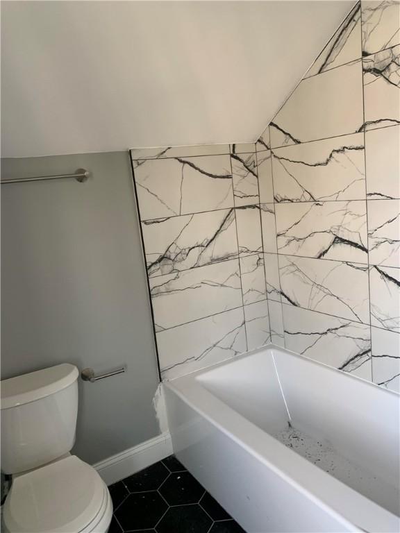 88 Reed St, Warwick, RI 02886 - bathroom with tile patterned flooring and toilet