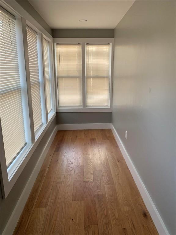88 Reed St, Warwick, RI 02886 - empty room featuring baseboards and wood finished floors