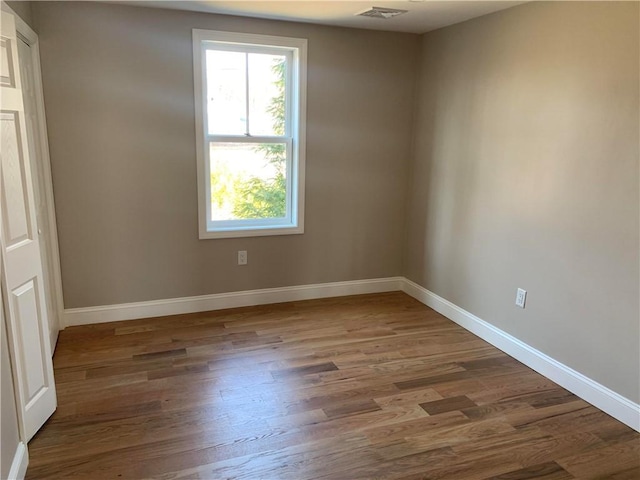 88 Reed St, Warwick, RI 02886 - unfurnished room featuring healthy amount of natural light and wood finished floors