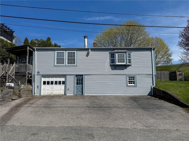 8 Tucker Ave, Tiverton, RI 02878 - back of house with an attached garage and driveway