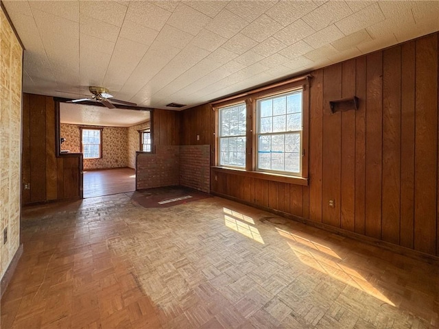 8 Tucker Ave, Tiverton, RI 02878 - unfurnished room with visible vents, a ceiling fan, and wooden walls