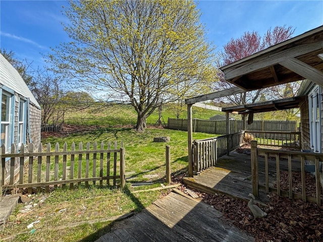 8 Tucker Ave, Tiverton, RI 02878 - wooden deck with a lawn and a fenced backyard