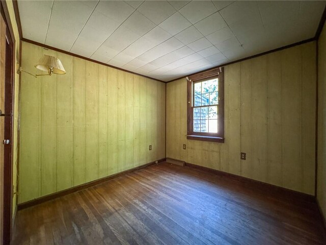 8 Tucker Ave, Tiverton, RI 02878 - spare room with wood-type flooring and wood walls