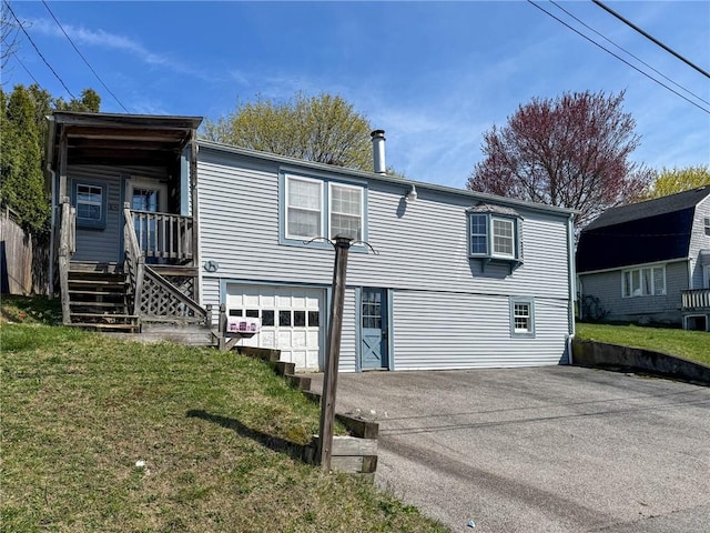 8 Tucker Ave, Tiverton, RI 02878 - exterior space with a lawn, driveway, stairway, and a garage