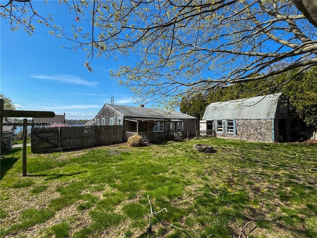 8 Tucker Ave, Tiverton, RI 02878 - view of yard with fence and an outbuilding