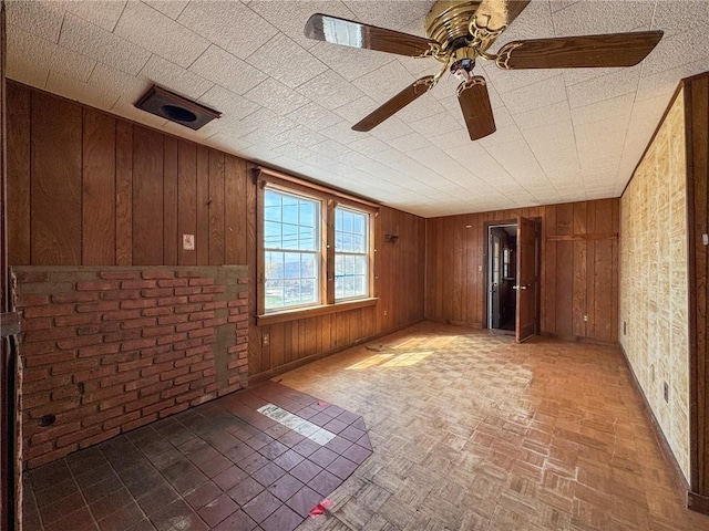 8 Tucker Ave, Tiverton, RI 02878 - spare room with wooden walls and ceiling fan
