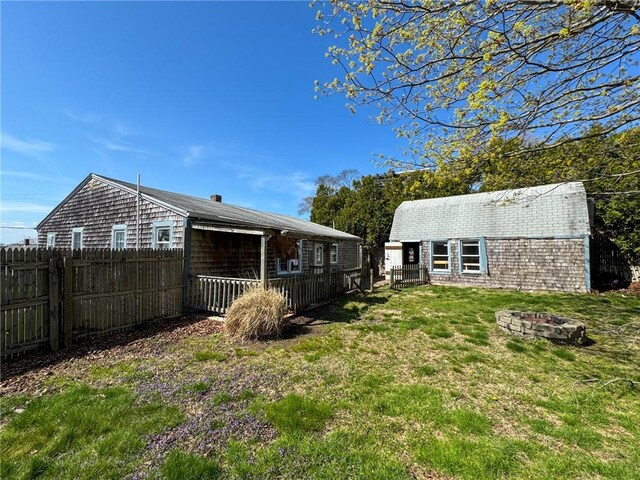 8 Tucker Ave, Tiverton, RI 02878 - view of yard featuring fence and a fire pit