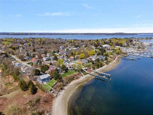 birds eye view of property featuring a water view and a residential view