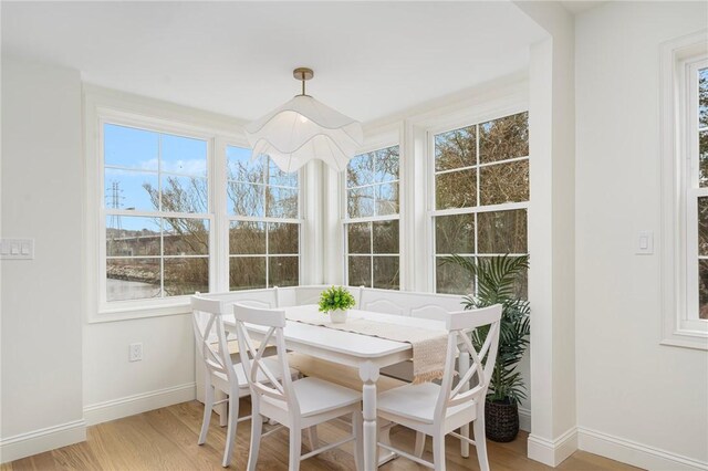 sunroom / solarium featuring a healthy amount of sunlight