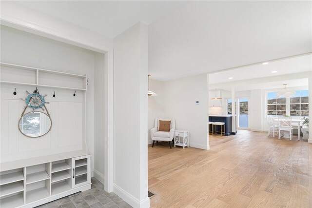 mudroom featuring baseboards, wood finished floors, and recessed lighting