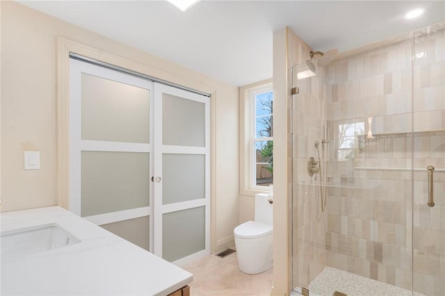 full bathroom with visible vents, toilet, vanity, and a stall shower
