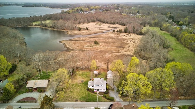 aerial view featuring a water view and a view of trees