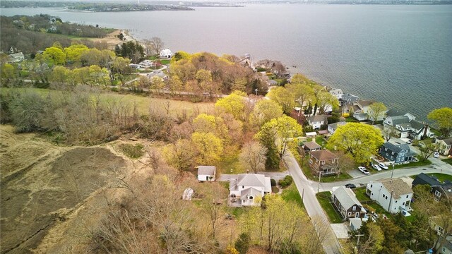 birds eye view of property featuring a water view and a residential view