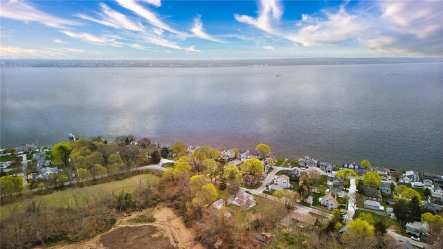 birds eye view of property featuring a water view and a residential view