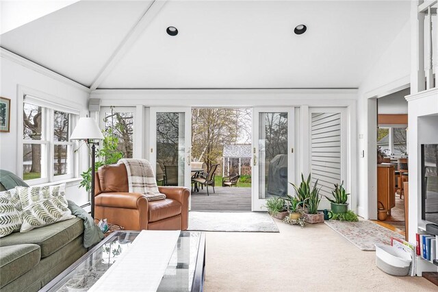 sunroom with beamed ceiling and a wealth of natural light