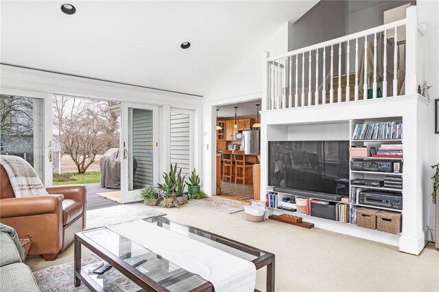 living room with recessed lighting and vaulted ceiling