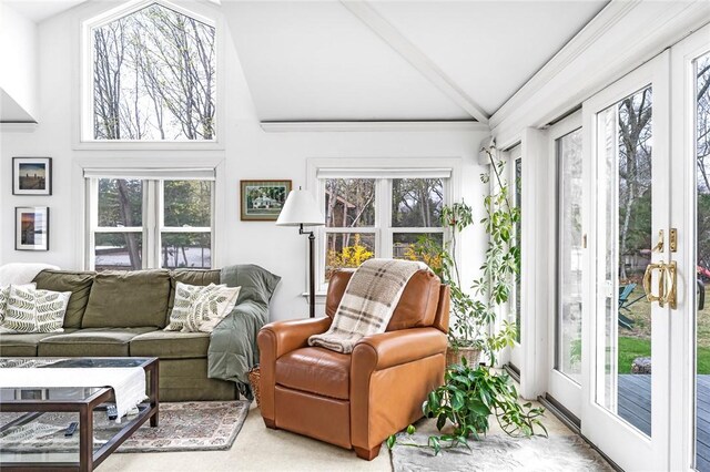 sunroom / solarium featuring french doors and lofted ceiling