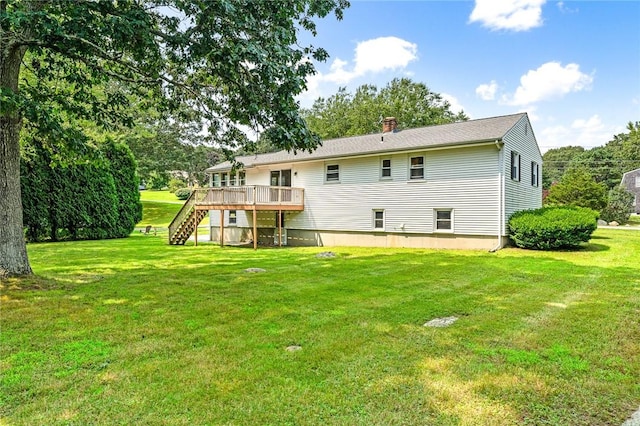 back of house with a chimney, a wooden deck, stairway, and a yard