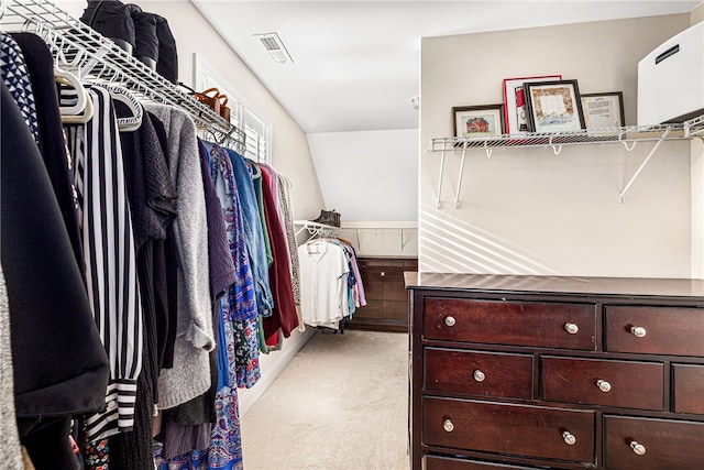 spacious closet featuring light colored carpet and visible vents