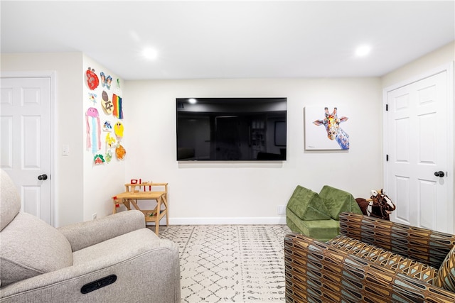 living room featuring baseboards and recessed lighting