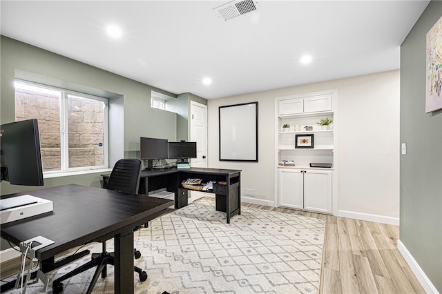 office space featuring visible vents, recessed lighting, light wood-style flooring, and baseboards