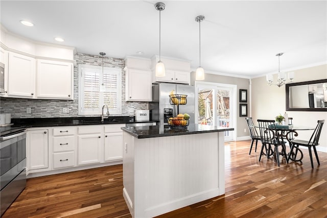 kitchen featuring appliances with stainless steel finishes, backsplash, and a healthy amount of sunlight