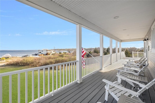 57 Foster St, Warwick, RI 02889 - wooden deck featuring covered porch, a yard, and a water view