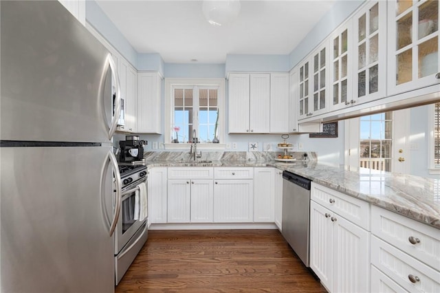 57 Foster St, Warwick, RI 02889 - kitchen featuring white cabinetry, stainless steel appliances, a sink, and plenty of natural light