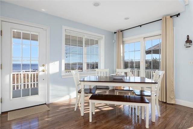 57 Foster St, Warwick, RI 02889 - dining area featuring dark wood-style flooring and baseboards