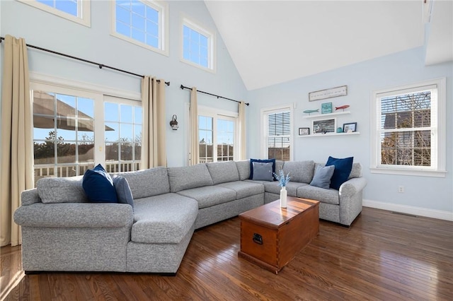 57 Foster St, Warwick, RI 02889 - living area with dark wood-style flooring, a healthy amount of sunlight, and high vaulted ceiling