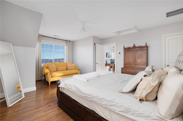 57 Foster St, Warwick, RI 02889 - bedroom featuring attic access, baseboards, visible vents, and wood finished floors
