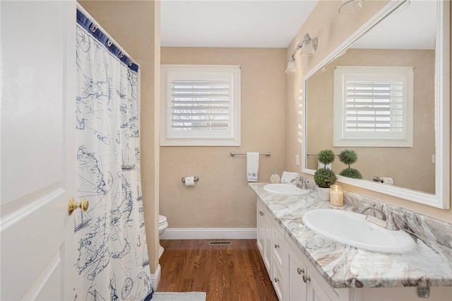57 Foster St, Warwick, RI 02889 - bathroom with toilet, plenty of natural light, and a sink