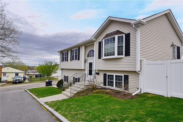 1 Augusta St, Providence, RI 02908 - bi-level home featuring fence and a front yard