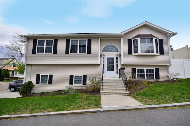 1 Augusta St, Providence, RI 02908 - bi-level home featuring fence and a front yard