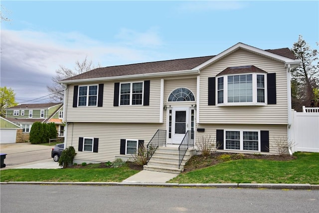 1 Augusta St, Providence, RI 02908 - bi-level home with fence and a front lawn