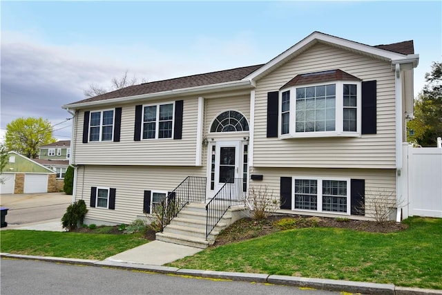 1 Augusta St, Providence, RI 02908 - raised ranch with a front lawn and fence