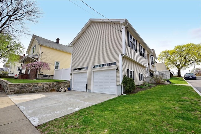 1 Augusta St, Providence, RI 02908 - view of property exterior with an attached garage, a lawn, and driveway